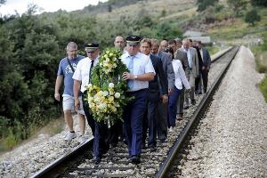 Rudine, July 23 2011 - Bozidar Kalmeta, minister of the Sea, Transport and Infrastructure, leads the honorary delegation to the accident site on the route section where tragic train accident took several passanger lives two years ago